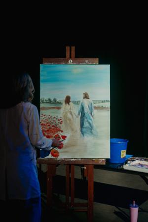Arlene Musselman painting as part of our gathered worship