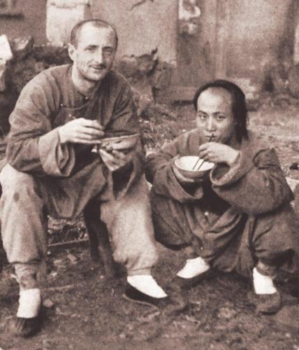 D.E. Hoste (left), one of the Cambridge Seven, having a meal on the street with a Chinese friend, adapting to local custom