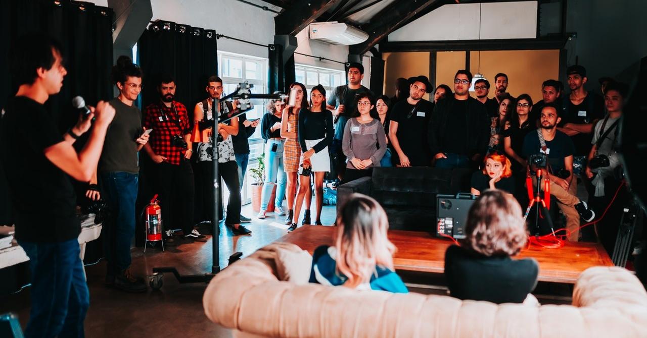 Group of people standing inside room 2608517