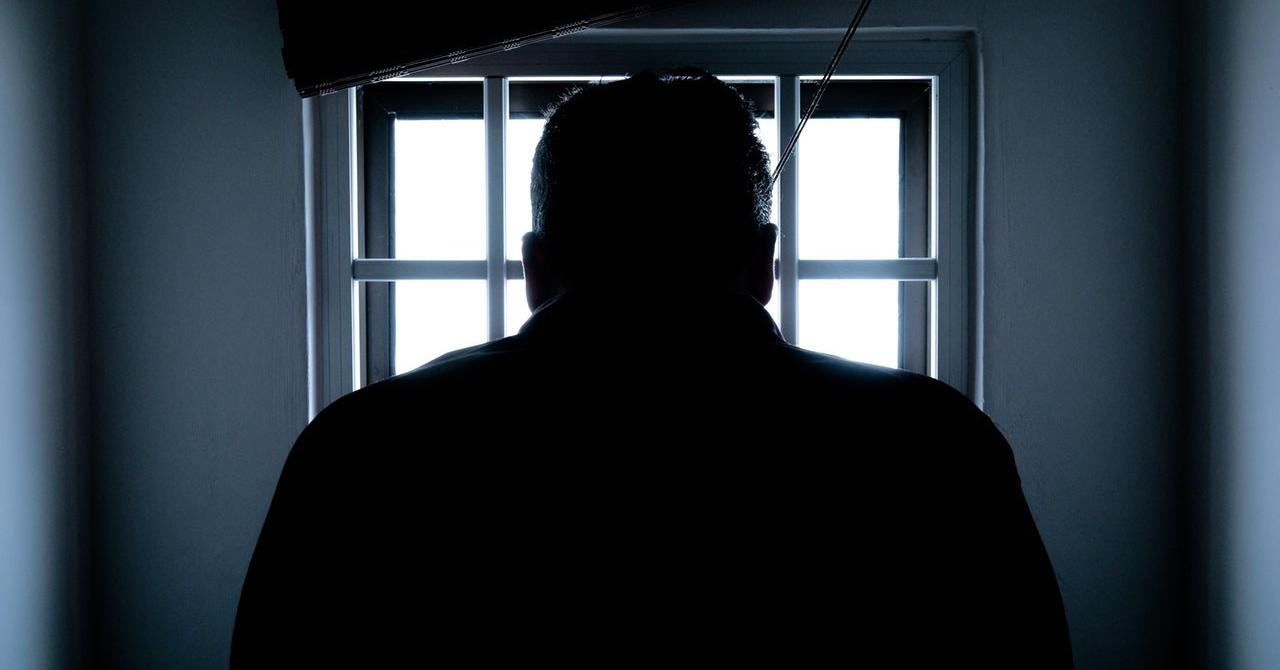 Silhouette of a man in window 143580