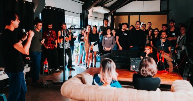 Group of people standing inside room 2608517